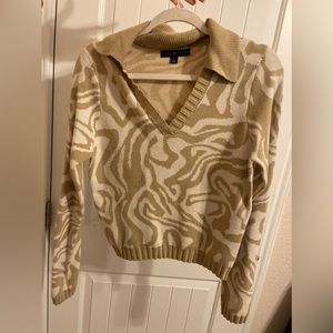 Tan long sleeve shirt.